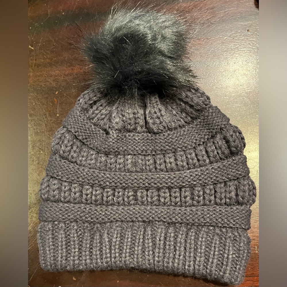 PRICED TO SELL- Woman’s warm dark grey knit hat with faux Pom Pom